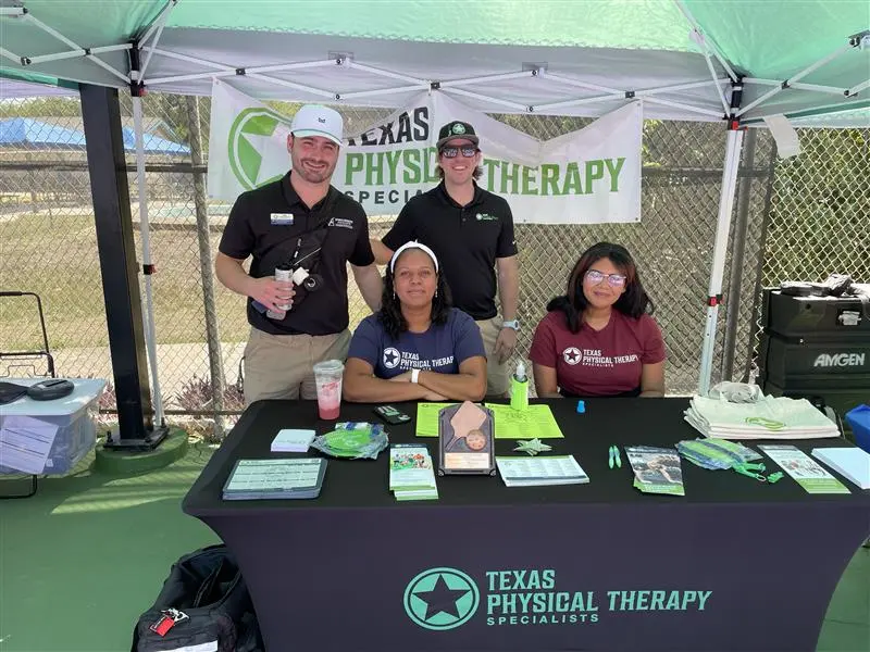 charity booth with volunteers representing TexPTS