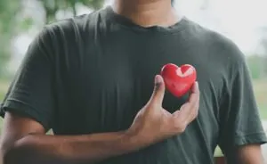 Hand holding red heart, World health day, Health care and mental health concept, Health insurance, Charity volunteer donation, CSR responsibility, World heart day, Self love.