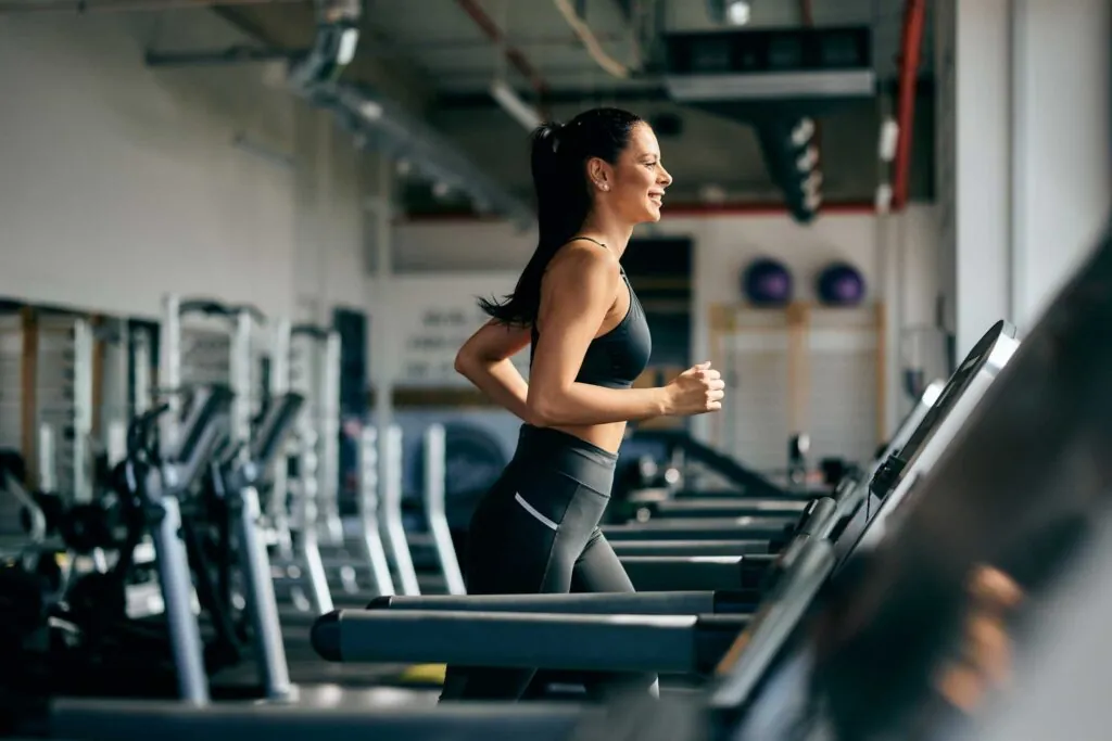 Group of young people fit friends doing exercises in gym