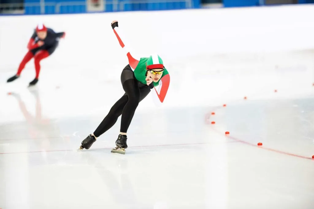Speed skating young female sportsman during competition race