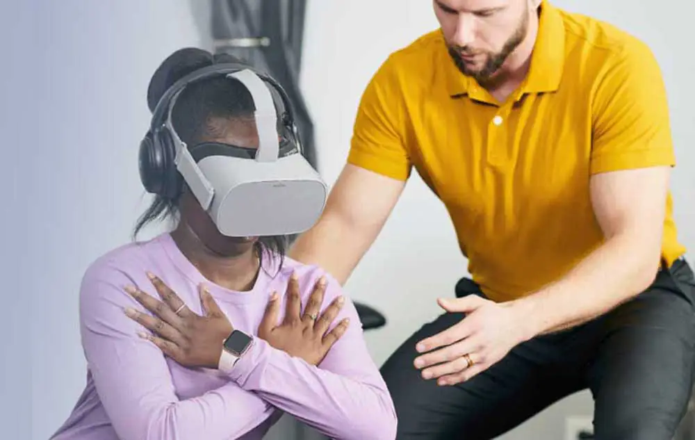 patient wearing VR goggles while doing exercises under PT supervision