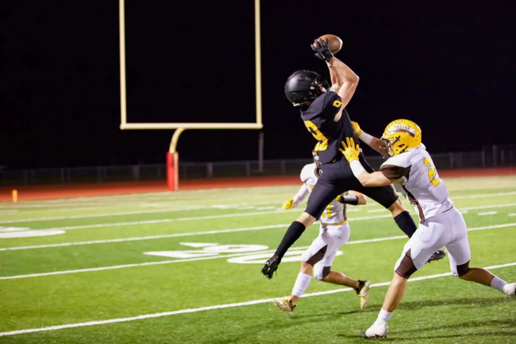 football player catching the ball